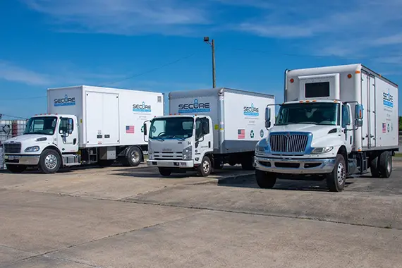 Secure Shredding and E-Recycling scheduled document shredding trucks for regular secure pickup service
