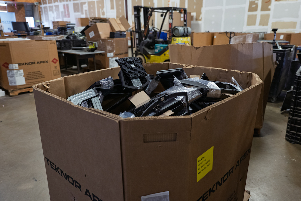 Bin filled with retired electronics awaiting secure data destruction, e-waste processing, and responsible recycling.